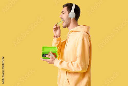 Young man in headphones wit...