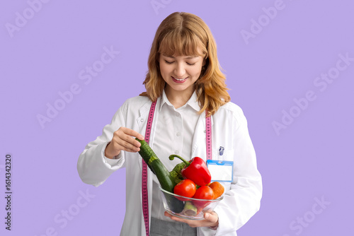 Young happy female nutritio...