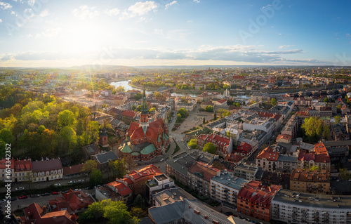 Colorful panorama of Podgorze district in Krakow, Poland during sunset at golden hour. 
Soft light, afternoon, panorama.