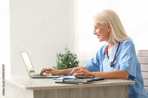 Female doctor working with ...