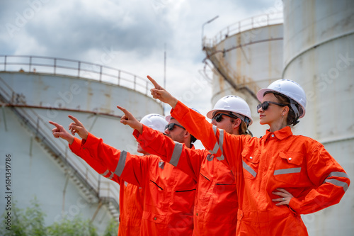 Papier peint Photo group male and female refinery engineer team in petrochemical plant