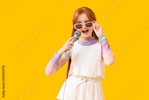 Teenage redhead girl in sun...