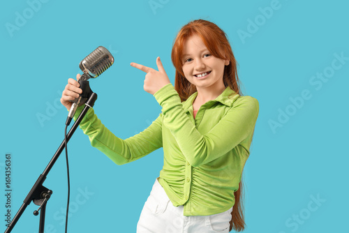 Teenage redhead girl pointi...