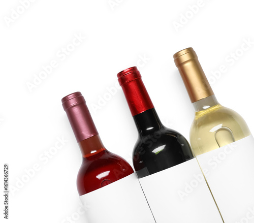 Bottles of wine on white ba...
