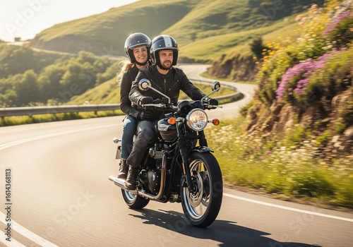 Adventure awaits: a couple riding a motorcycle on a scenic mountain road on a sunny day.