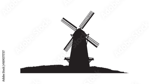 Windmill silhouette with rotating blades in rural countryside landscape scene