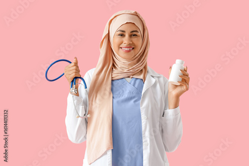 Smiling muslim female docto...