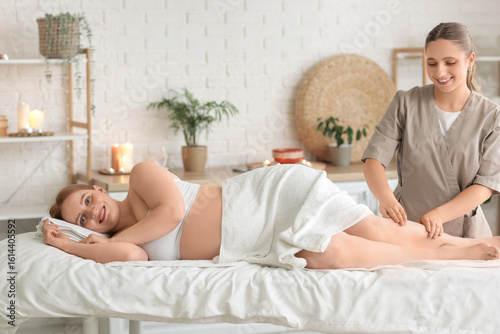 Young pregnant woman gettin...