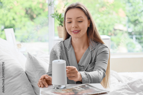 Young woman turning air hum...