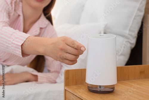 Young woman turning air hum...