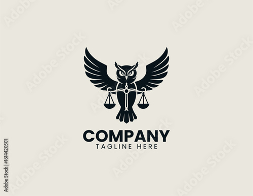 Majestic golden owl with outstretched wings holding scales of justice on a dark background. Legal concept