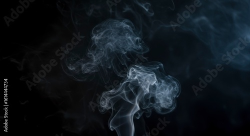 Abstract smoke swirls against a dark background (2)