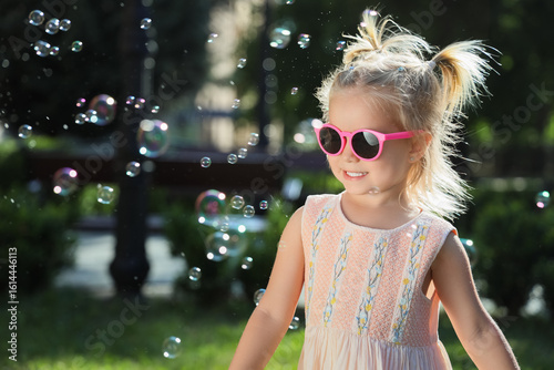 Cute little girl with sungl...