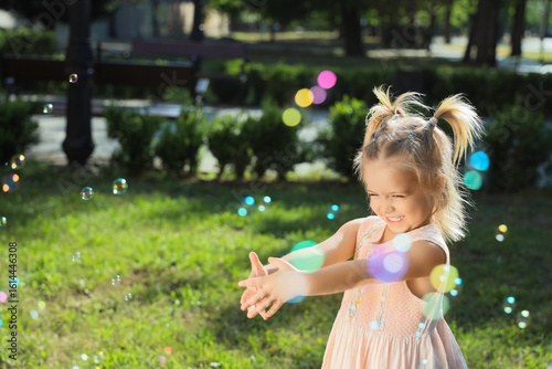 Cute little girl with soap ...