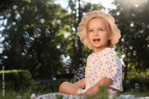 Cute little girl with soap ...