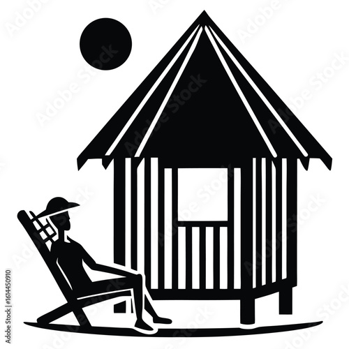 Silhouette of a beach hut and a sunbather on a sunny day