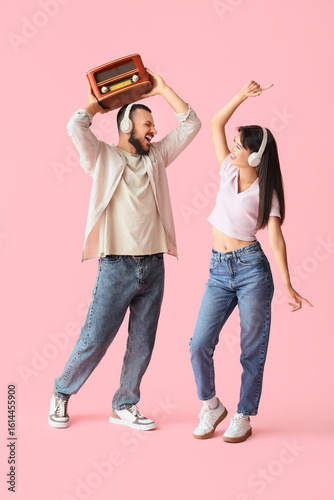 Young couple in headphones ...