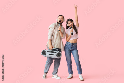 Young couple in headphones ...