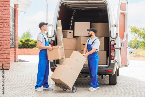 Male movers unloading boxes...