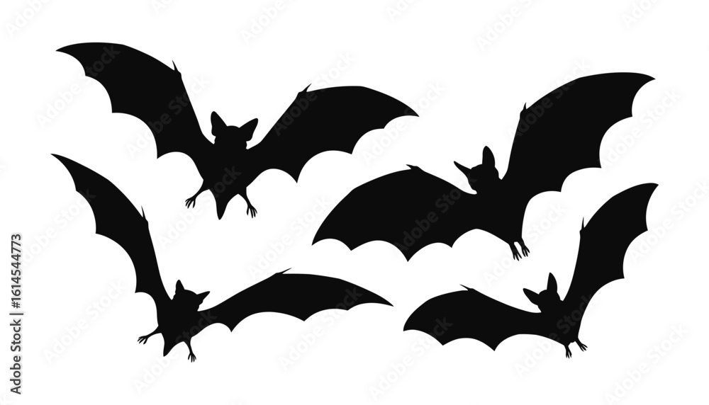 Fototapeta premium A group of flying bats in a dark silhouette on white background.