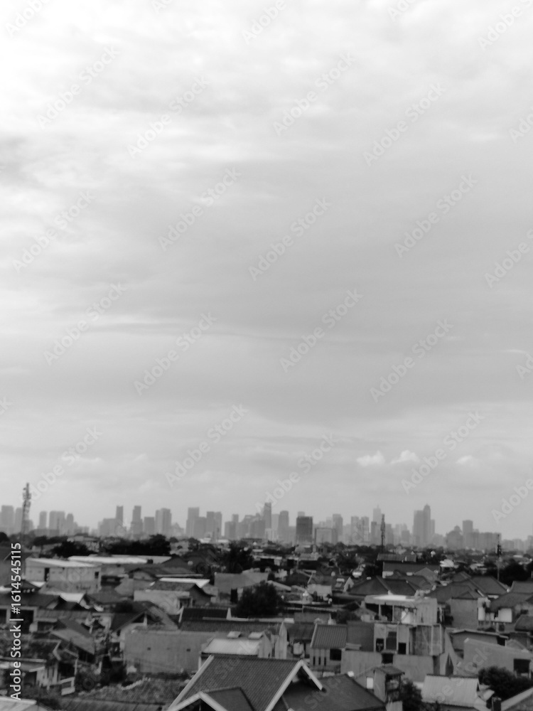Obraz premium view from the parking lot showing tall buildings in the distance, black and white photo