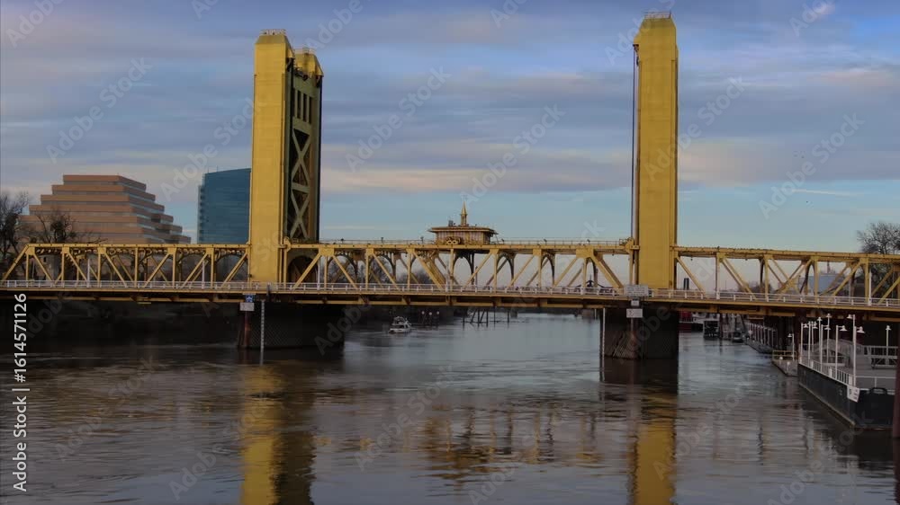 The Tower Bridge in Sacramento, California, USA, spans the Sacramento River. The bridge is a vertical lift bridge, with towers on either side of the river. The Tower Bridge in Sacramento, California, USA, spans the Sacramento River. The bridge is a vertical lift bridge, with towers on either side of the river.