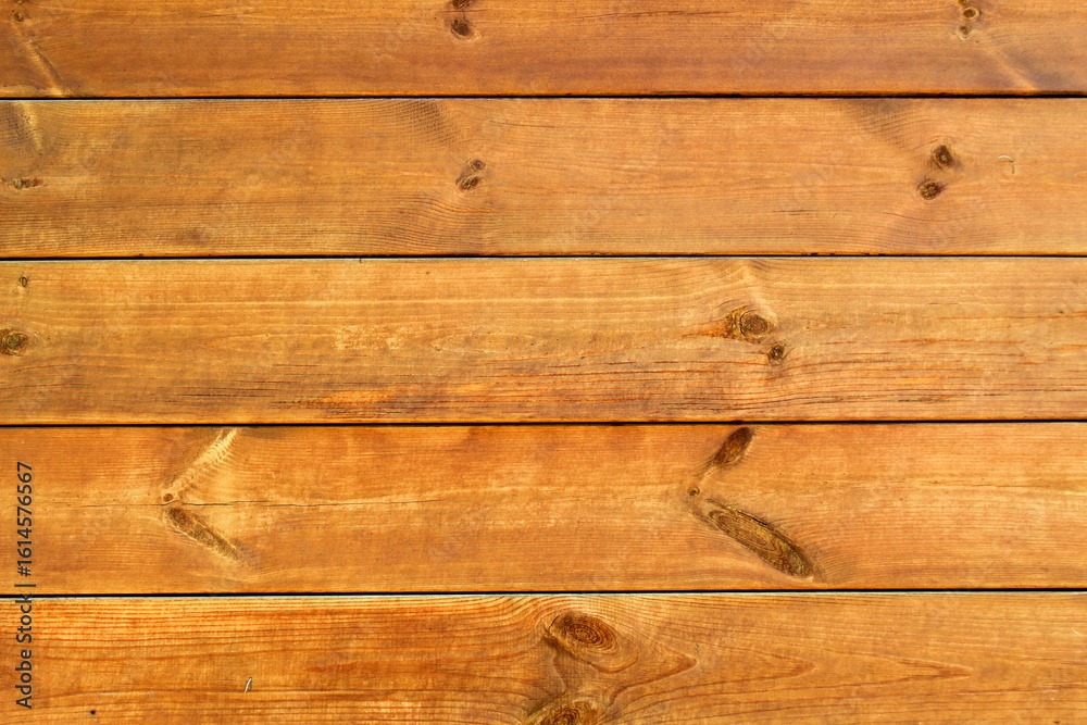 Fototapeta premium Texture of wooden panel painted in natural brown color.