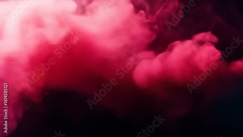 Red smoke drifts against a dark backdrop, blurred abstract effect
