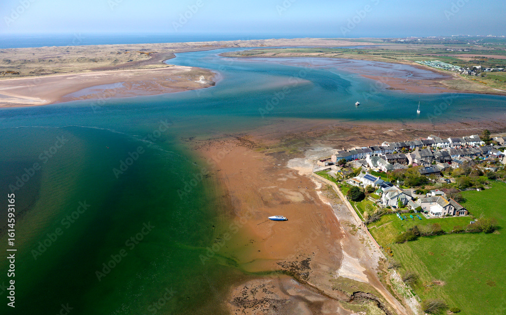 Fototapeta premium Ravenglass fishing village and site of Roman port of Itunocelum on mouth of River Esk on W coast of Cumbria. View to NW
