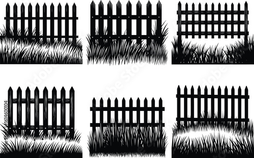 Rustic wooden picket fence with tall grass silhouette