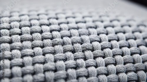 Gray woven fabric texture with soft yarn creating detailed textile