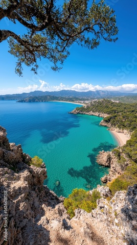Scenic Coastal View of Turquoise Waters and Rocky Shores Under Clear Blue Sky