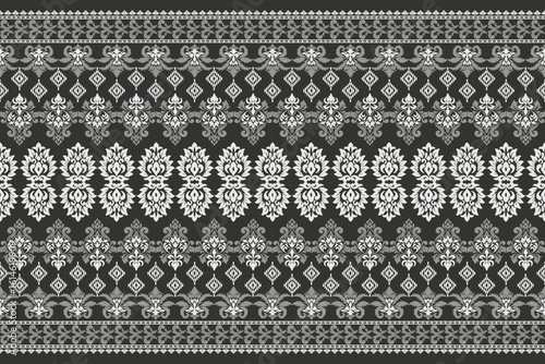 Seamless white and grey floral damask shape with geometric ethnic tradition pattern texture on natural black background
