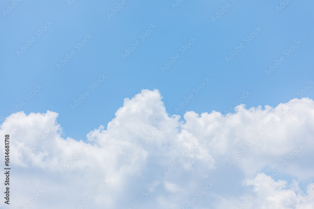 Fluffy White Clouds in a Bright Blue Sky. Fluffy White Clouds in a Bright Blue Sky.