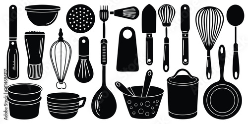 Collection of black and white kitchen utensils and cooking tools arranged artistically