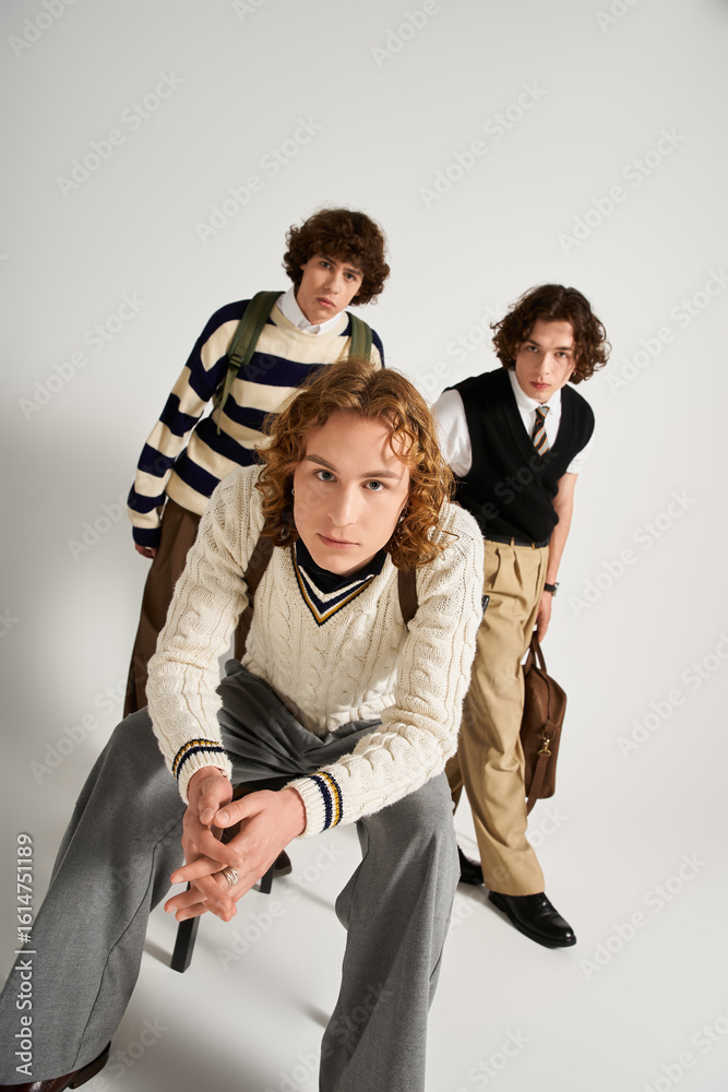 Stylish young friends showcasing unique fashion in a modern studio setting together Stylish young friends showcasing unique fashion in a modern studio setting together