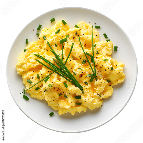 scrambled eggs with chives on a white plate isolated on a white background
