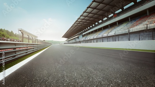 Empty Asphalt Racing Track with Grandstand and Guardrails in Sunny Weather