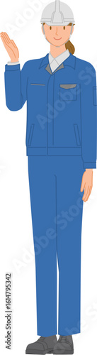 ビジネスイメージ：作業服とヘルメットを身に付けた笑顔の若い女性：手で指し示す