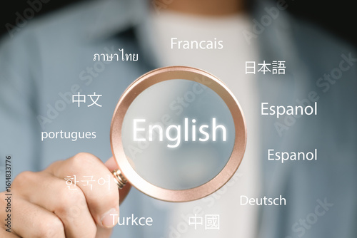 Businessman use Magnifier focus to English language translation or translate on worldwide language conversation speaking concept.
