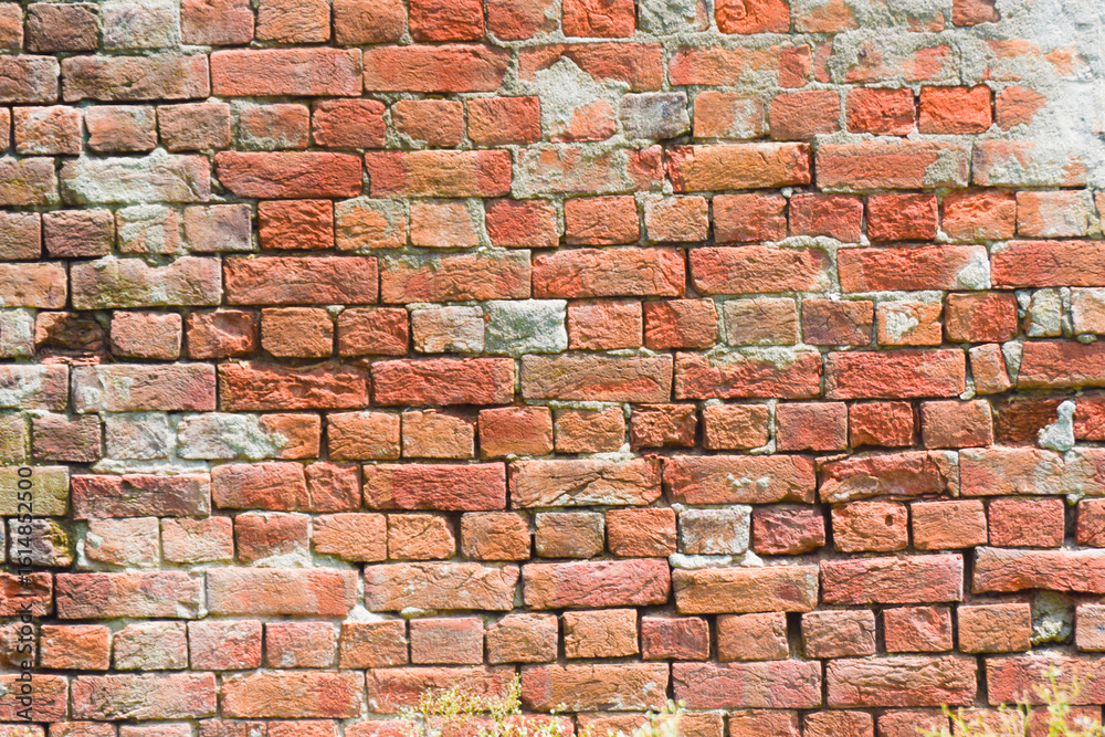 Obraz premium brick wall old red brick wall with dust and debris on white background. Broken brick wall with scattered debris and visible cracks.
