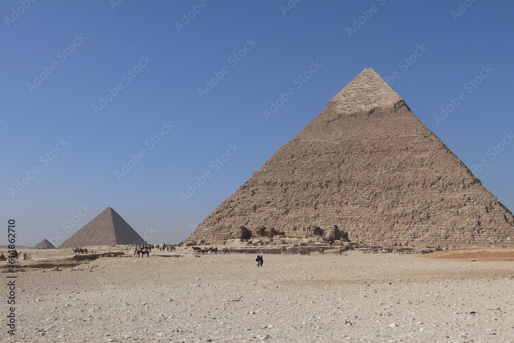 Great Pyramids of Giza under a clear sky. Great Pyramids of Giza under a clear sky.