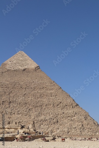 The Great Pyramid of Giza under a clear blue sky.