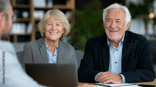Thoughtful senior clients reviewing important paperwork with an advisor or solicitor in a credible setting, surrounded by legal files, laptop, and warm interior lighting, retirement planning meeting, 