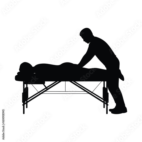 Silhouette of a person giving a massage to another person on a massage table
