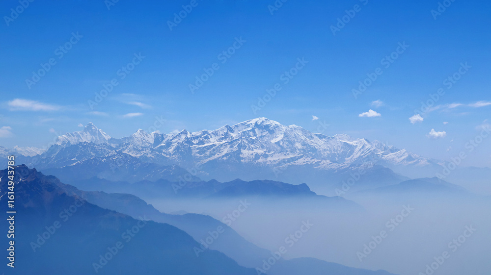 Fototapeta premium Panoramic view of Himalayan mountain range from Chandrashila Peak, located in Chopta, Rudraprayag, Uttarakhand, India.