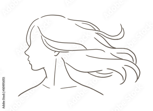 美しい長い髪が風になびいている女性の横顔