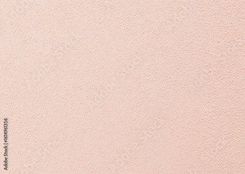 Peach textured wall background with small granules