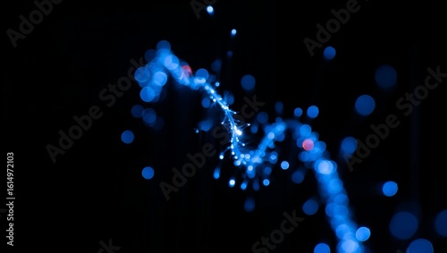 Wallpaper Mural Sparkle, trail, particles, light, glow, blue — a luminous blue sparkle trail winds gracefully through darkness, scattering glowing particles outward, their radiance softly fading into black, captured  Torontodigital.ca