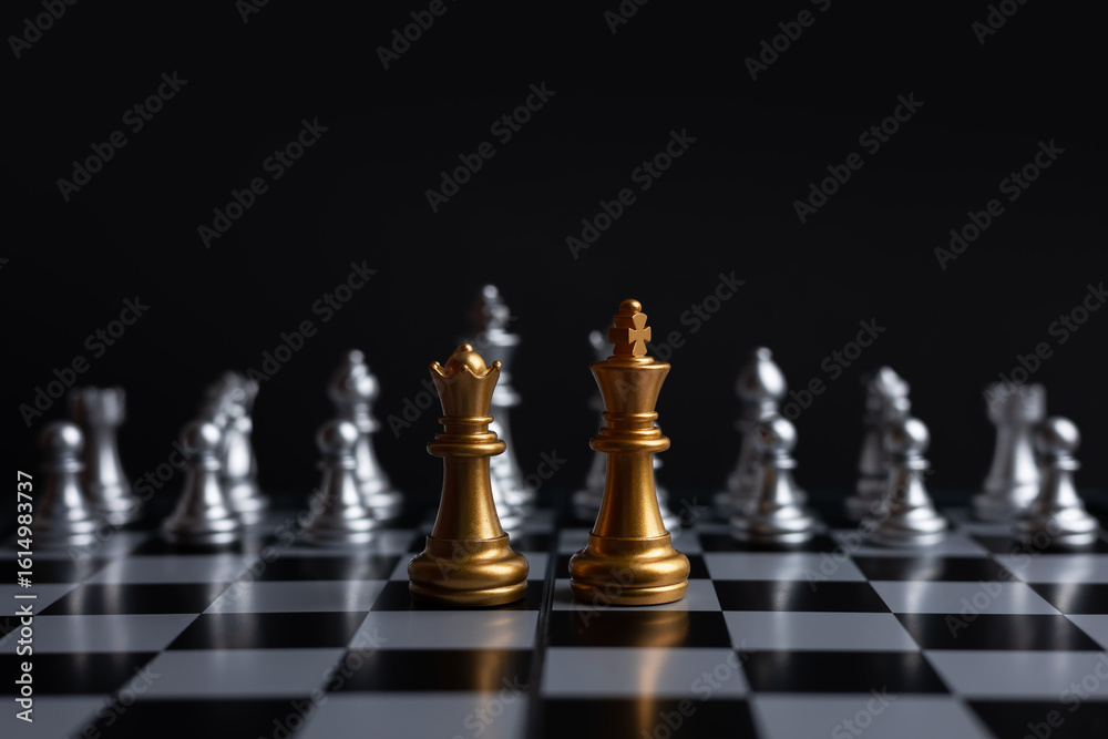 Chess. golden King and Queen on the board. The most powerful figures Chess. golden King and Queen on the board. The most powerful figures